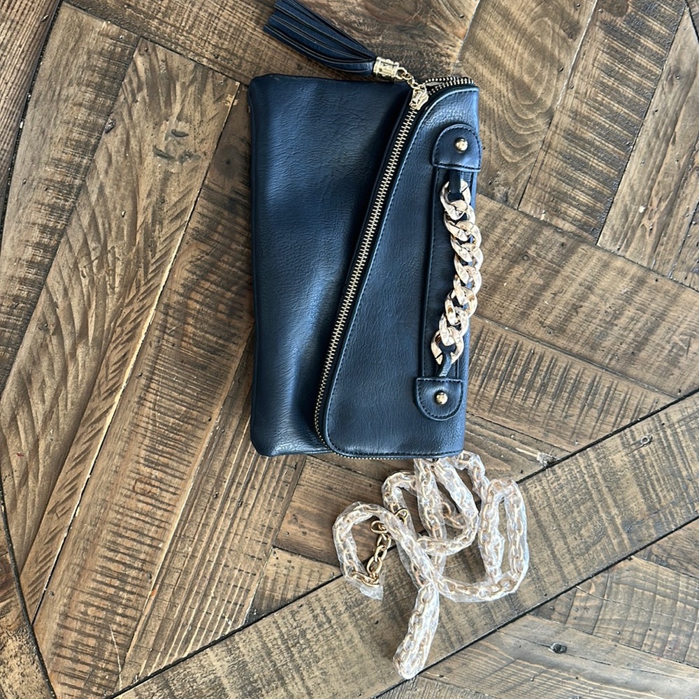 Navy clutch with gold details. Gold chain strap.